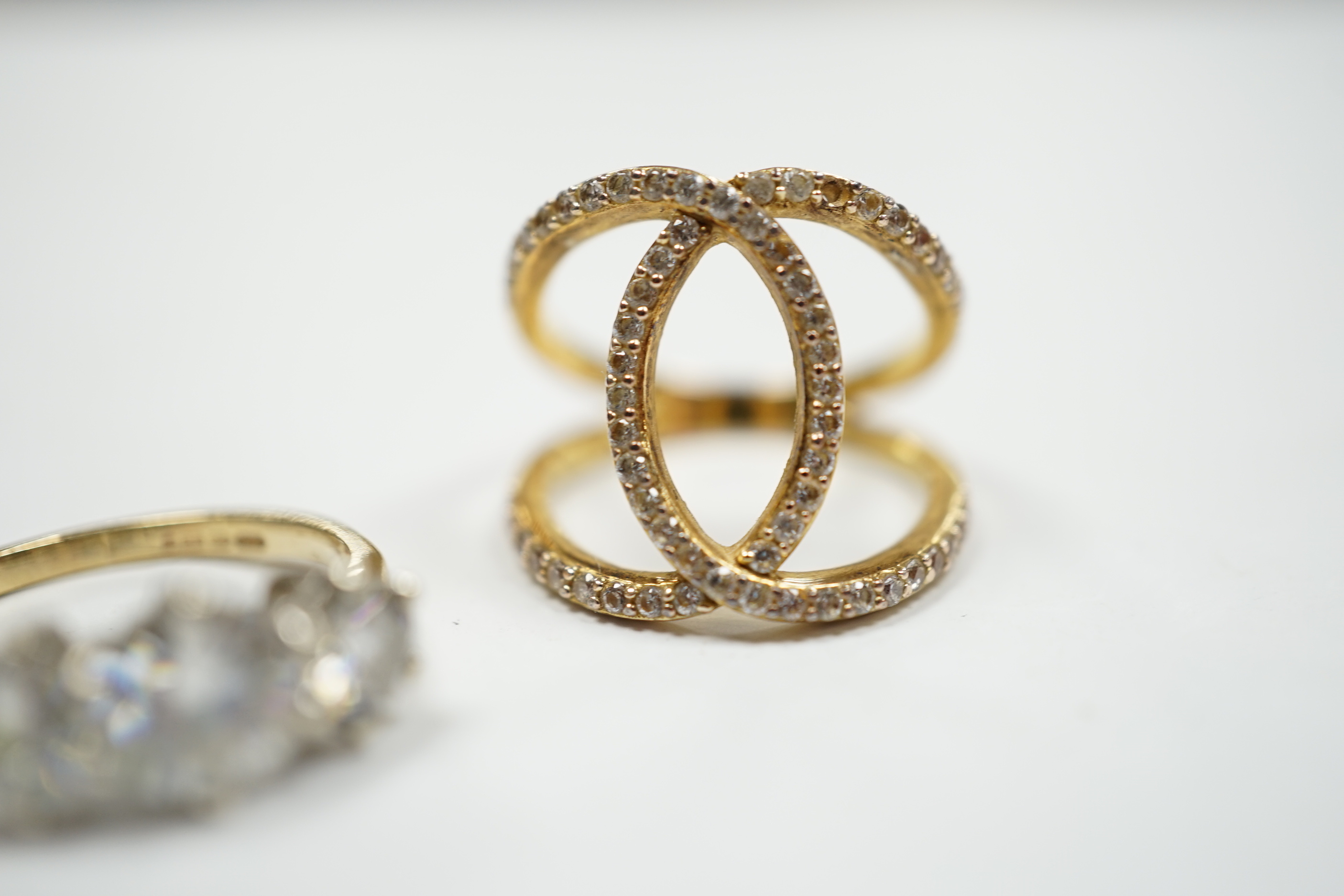 A 9ct gold and three stone simulated diamond ring and a gilt 925 ring.